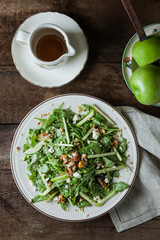 A gourmet salad on rustic surface, vertical, top view