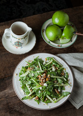 A gourmet salad on rustic surface, vertical, top view