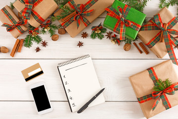 Christmas wish list on white wood table background