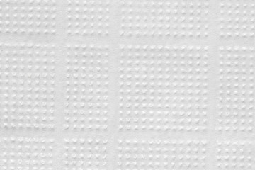 Texture of a napkin of white color with pictures. Background for various purposes.