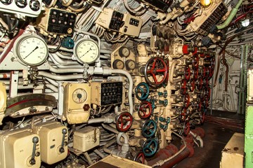 Interior of combat submarine compartment with devices of control.