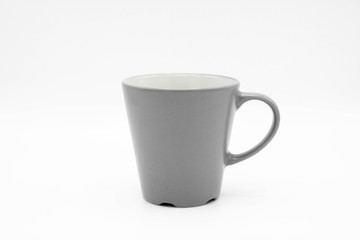 grey ceramic cup on a white background