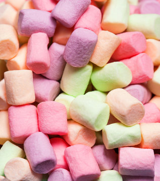 Colorful mini marshmallows background macro. Fluffy marshmallows texture and pattern. High Resolution image, Soft focus