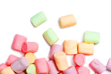 Colorful small marshmallows isolated on white background, macro. Fluffy marshmallows texture and pattern. Flat lay or top view. Winter food background concept.