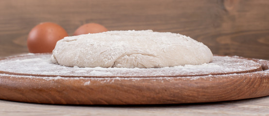 Food ingredients for dough a wooden kitchen board. Cake recipies