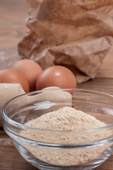 Food ingredients for dough a wooden kitchen board. Cake recipies