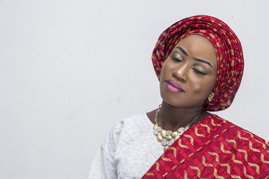 a young African lady in complete Yoruba attire
