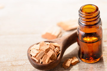 Sandalwood essential oil on the table