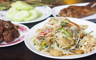 papaya salad.Fried pork.Grilled chicken and fresh vegetable Put on the table, use as a background
