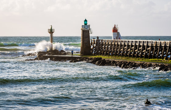 lighthouse, pier and breaking waves, Capbreton, France