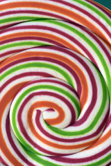 Close-up of colorful lollipop in spiral shape