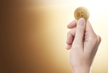Hand holding a Bitcoin Cash coin on a gently lit background with copy space. 3D rendering