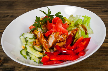Teriyaki Chicken salad on a wooden background. 