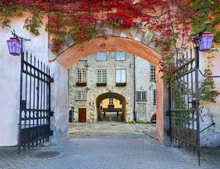 Gate to the ancient buildings in medieval European town