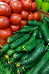 Fresh cucumbers and tomatoes in the greek grocery shop.