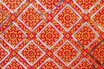 Texture on the wall. Thai traditional texture made by glass and golden.