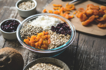 Homemade granola with dried apricots, cranberries, coconut, sunflower seeds, and oatmeal