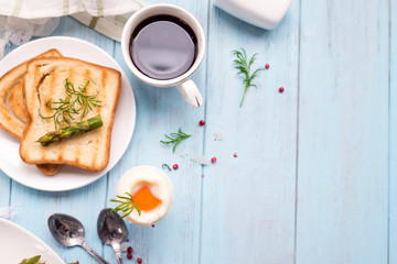 Breakfast with egg and a cup of coffee