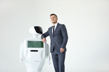 Humanoid autonomous robot with stylish man in a suit. Modern Robotic Technologies. Humanoid...