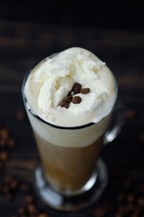 Delicious black coffee with ice cream on the table 