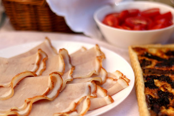 Slices of ham on a plate. Selective focus. 