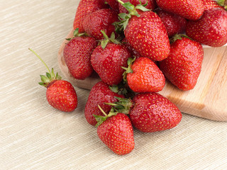 Beautiful ripe strawberry on a fabric background