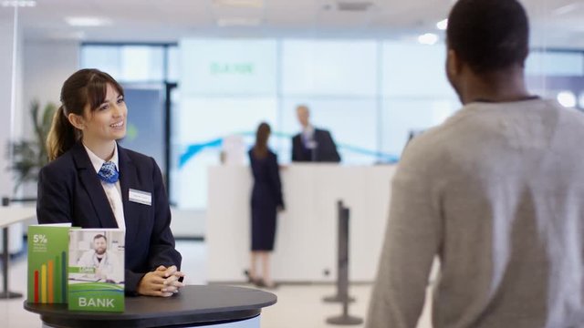  Customer waits to meet with financial adviser in modern bank