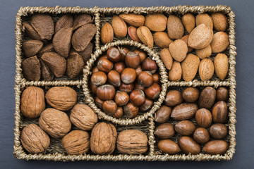 A selection of in-shell Brazil nuts, walnuts, almonds, hazelnuts and pecan nuts