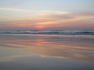 Fototapeta na wymiar Predawn Reflection- Reflection of predawn sky on beach