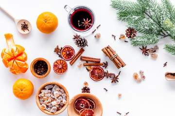 Fototapeta na wymiar Ingredients mulled wine or grog with spices and citrus for winter evening. Christmas new year eve. White background top view.