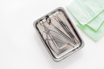 Dentists accessories. Tools on white background top view copyspace