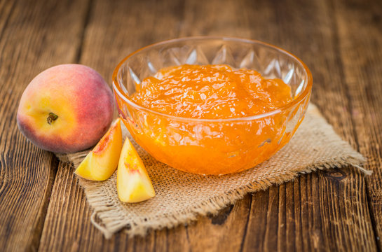 Fresh made Peach Jam on a rustic background