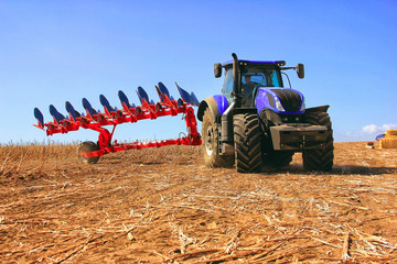 combine harvester, working on the harvest of a ripe sunflower. Agriculture. Cultivated area.