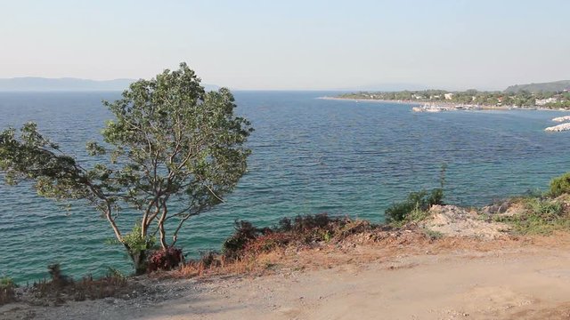 Landscape of beautiful settlement in calm bay, coast.