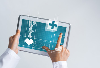 Close of female doctor hands working with tablet pc computer