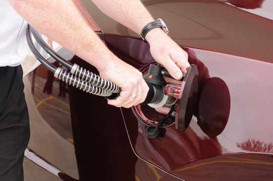 Man Attaches Nozzle To Car While Refuelling A Hydrogen Powered Vehicle