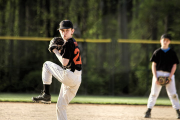 Pitcher Winding Up In Youth Baseball Game