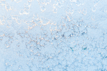 Ice pattern on the frosty window. Beautiful winter background.
