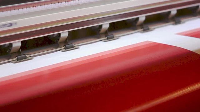 Wide format digital printing. Self adhesive film. Red color.