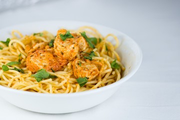 Spaghetti with chicken meat and cream sauce