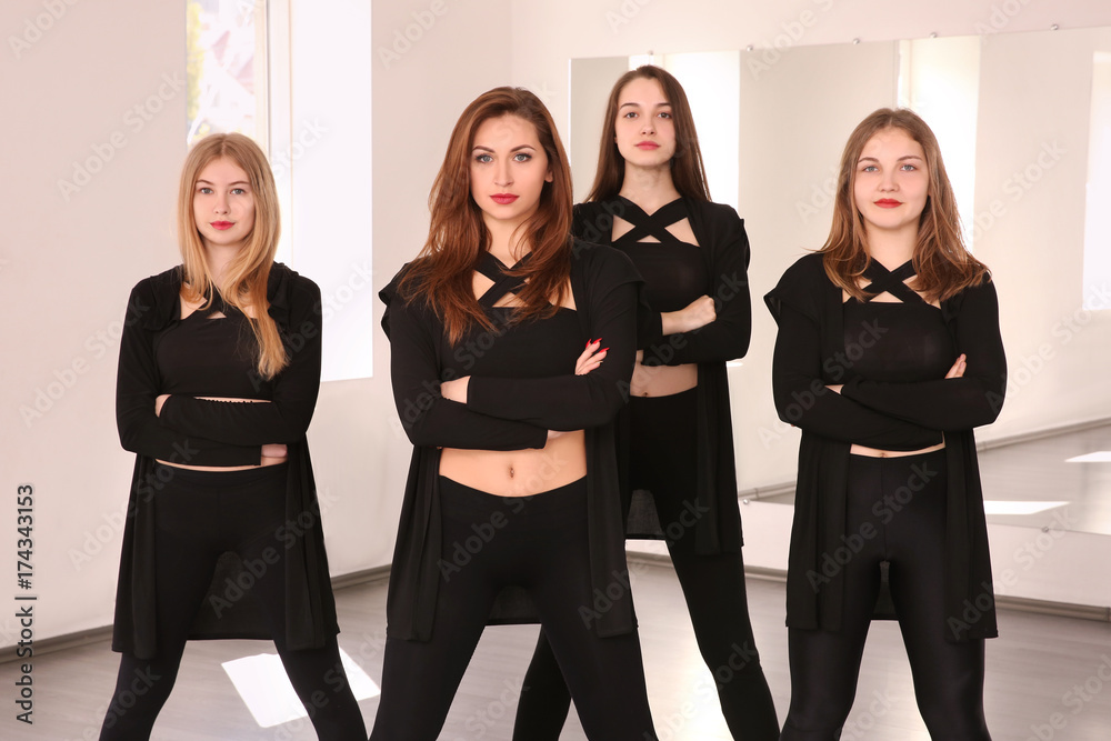 Poster Group of young dancers in studio