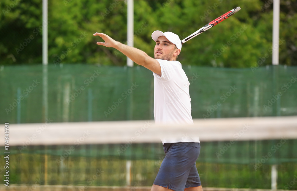 Sticker Young man playing tennis on court