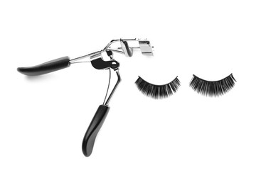 Curler and eyelashes, isolated on white