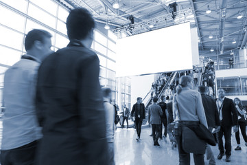 blurred visitors at a trade fair
