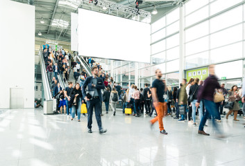 blurred visitors at a trade fair