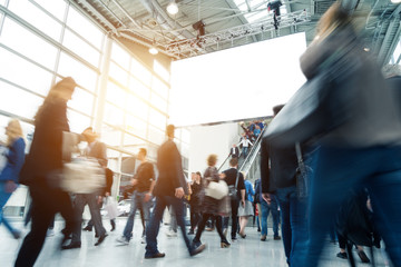 blurred visitors at a trade fair