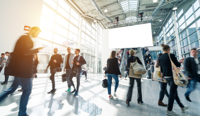 blurred visitors at a trade fair