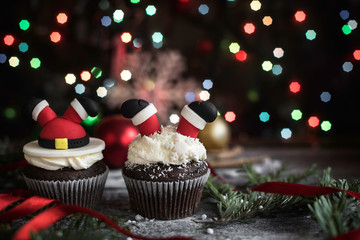 Santa Claus cupcakes on Christmas decoration with blank space