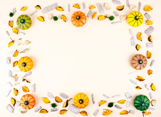 Decorative pumpkins on beige background .