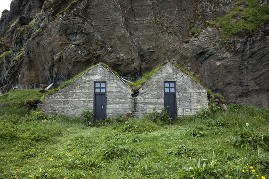 Cabins on grassy landscape